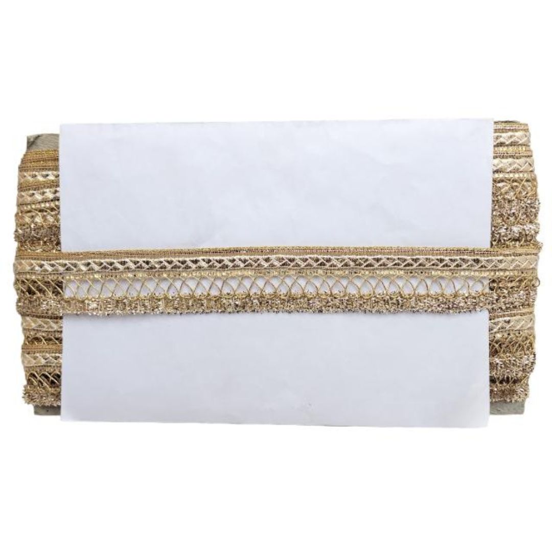 White clutch bag with gold braided trim on a white background