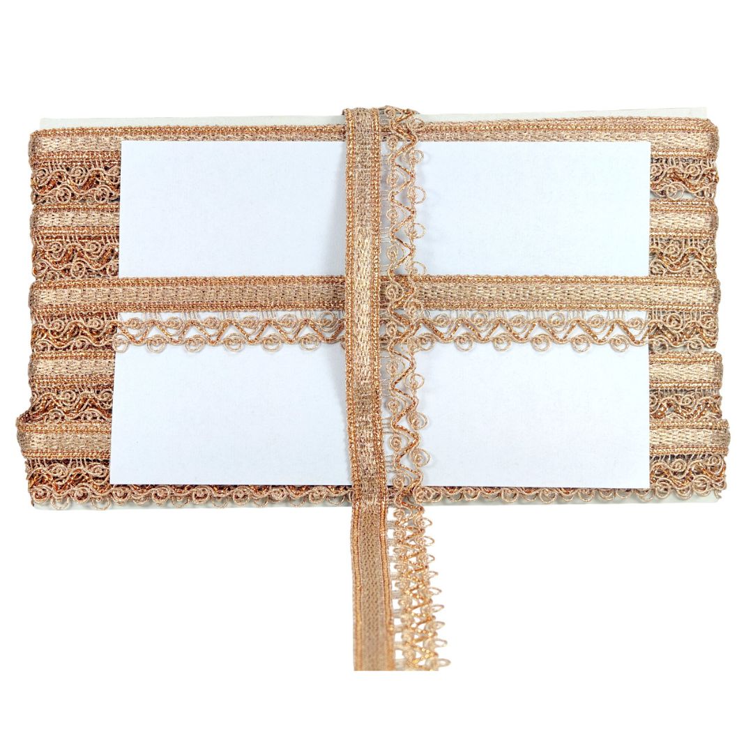 Four white cards with gold lace borders on a white background
