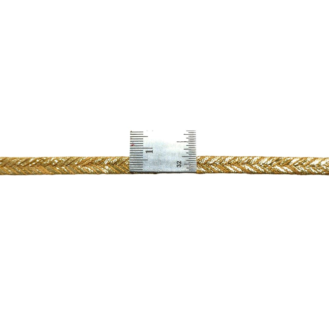 Gold braided cable with a label on a white background