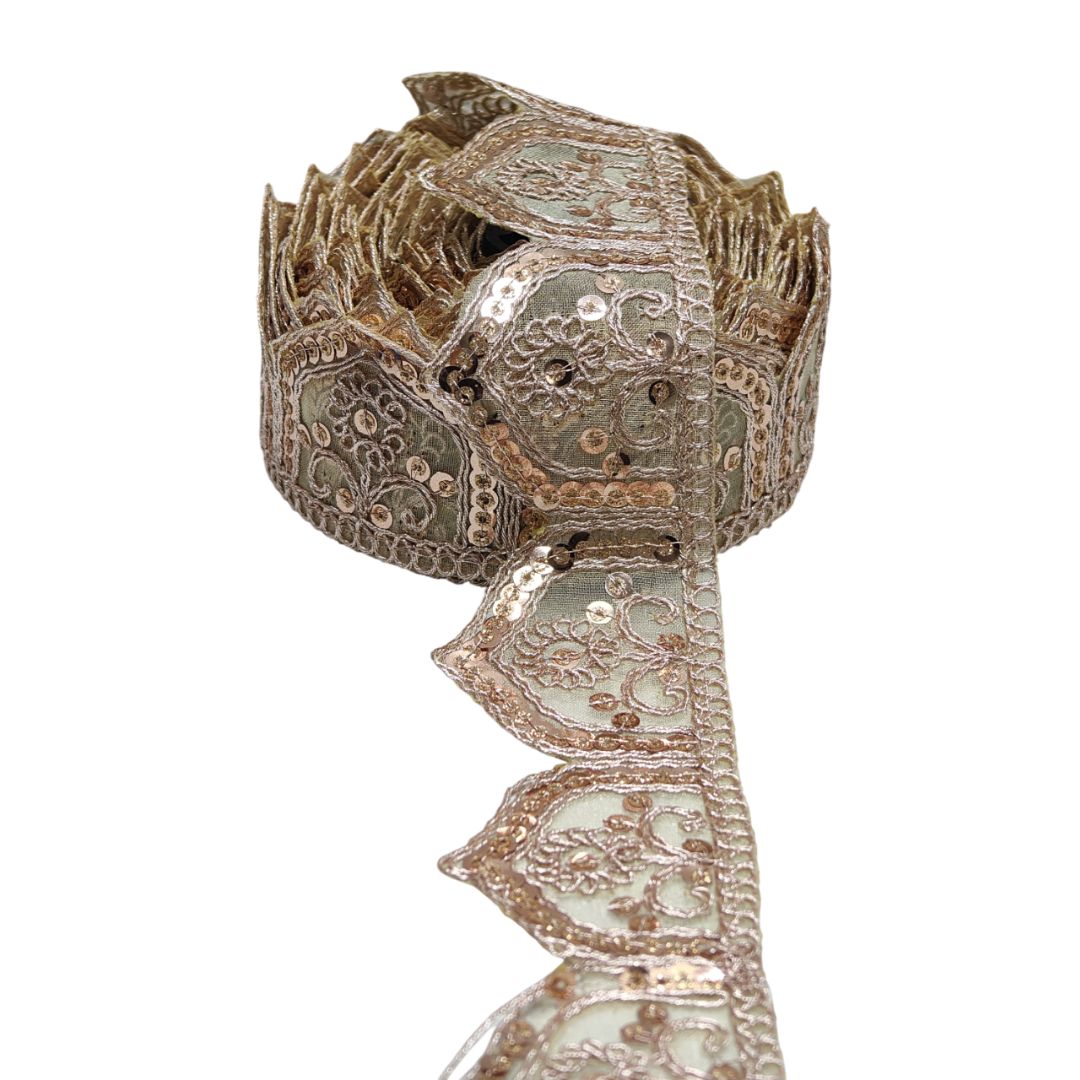 Decorative headpiece with intricate patterns on a white background