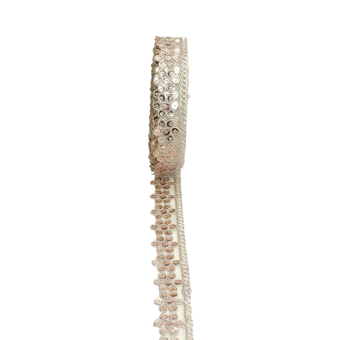 Decorative ribbon with rhinestone embellishments on a white background