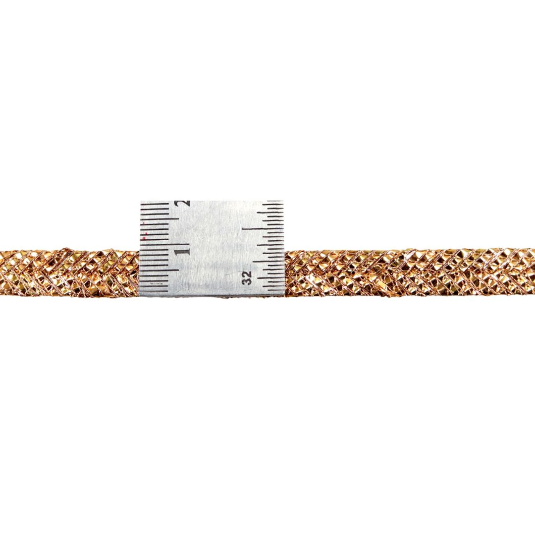 Gold glittery strip with a measuring tape on a white background