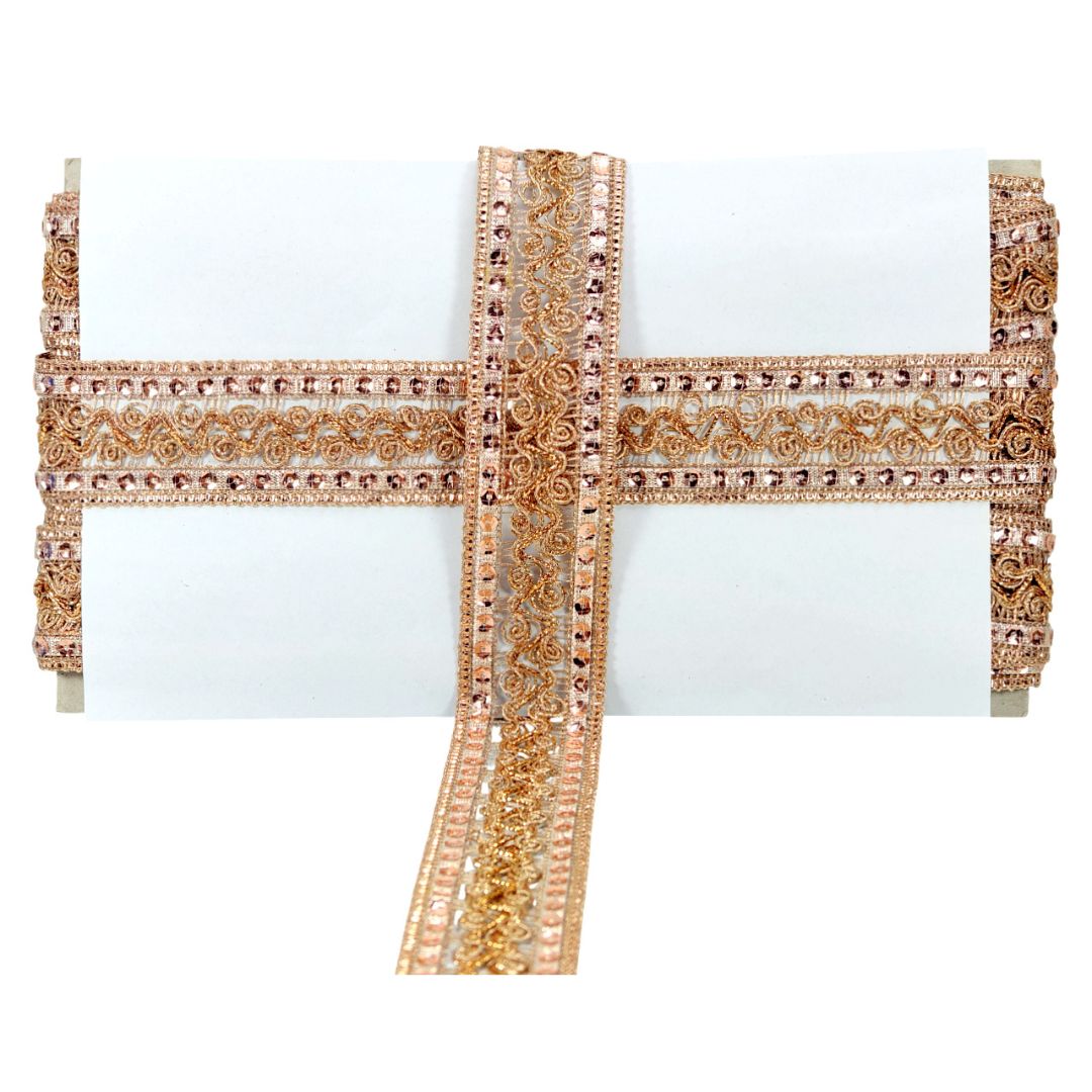 Decorative headband with gold and white design on a white background