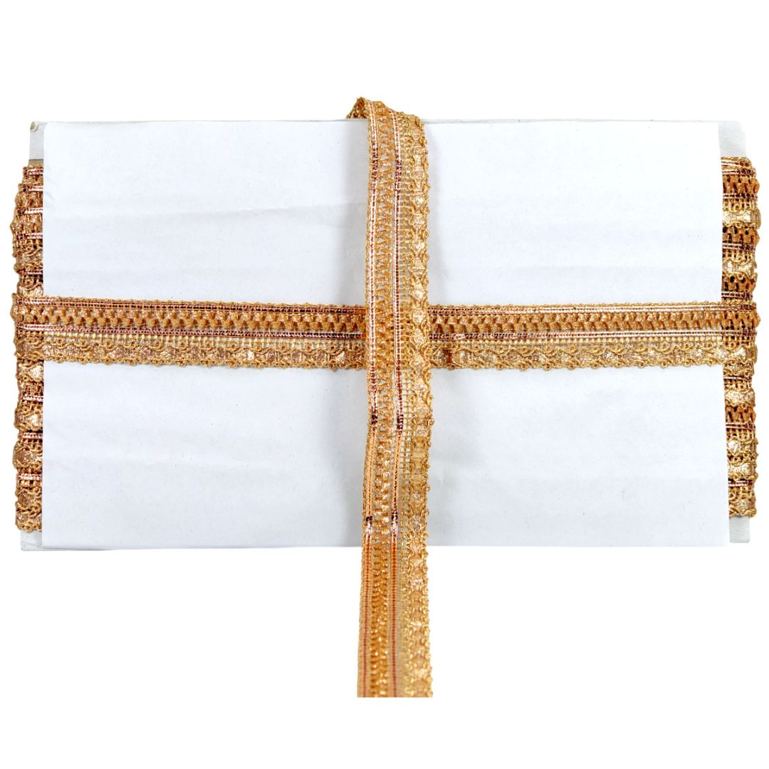 White pillow with gold decorative trim on a white background