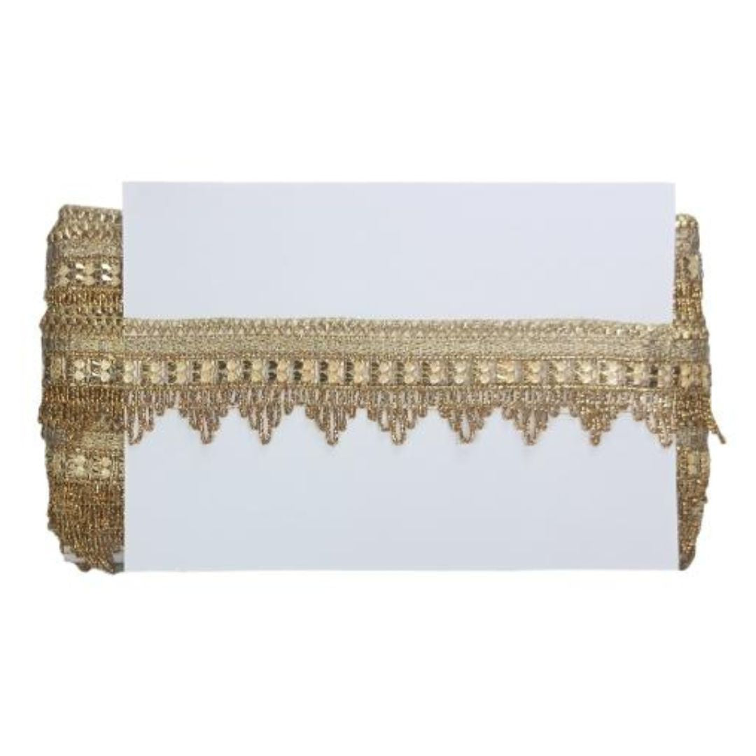 Gold beaded clutch with a white card inside on a white background