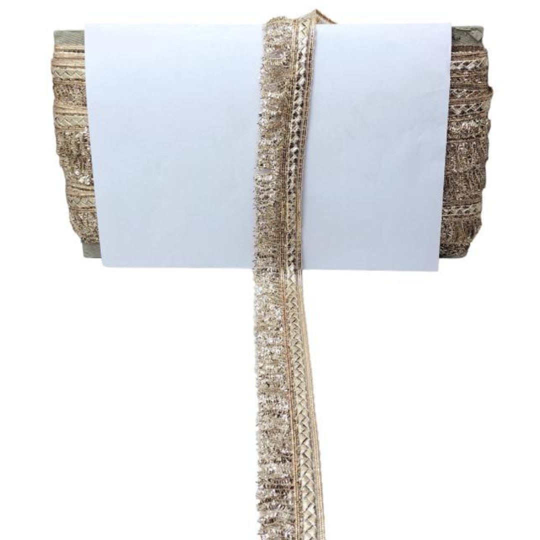 Decorative ribbon with gold and silver trim on a white background