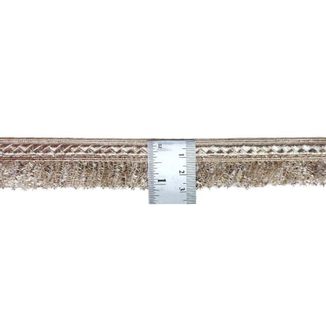 Textured fabric border with a ruler for scale on a white background