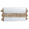White clutch with gold fringe and sequins on a white background