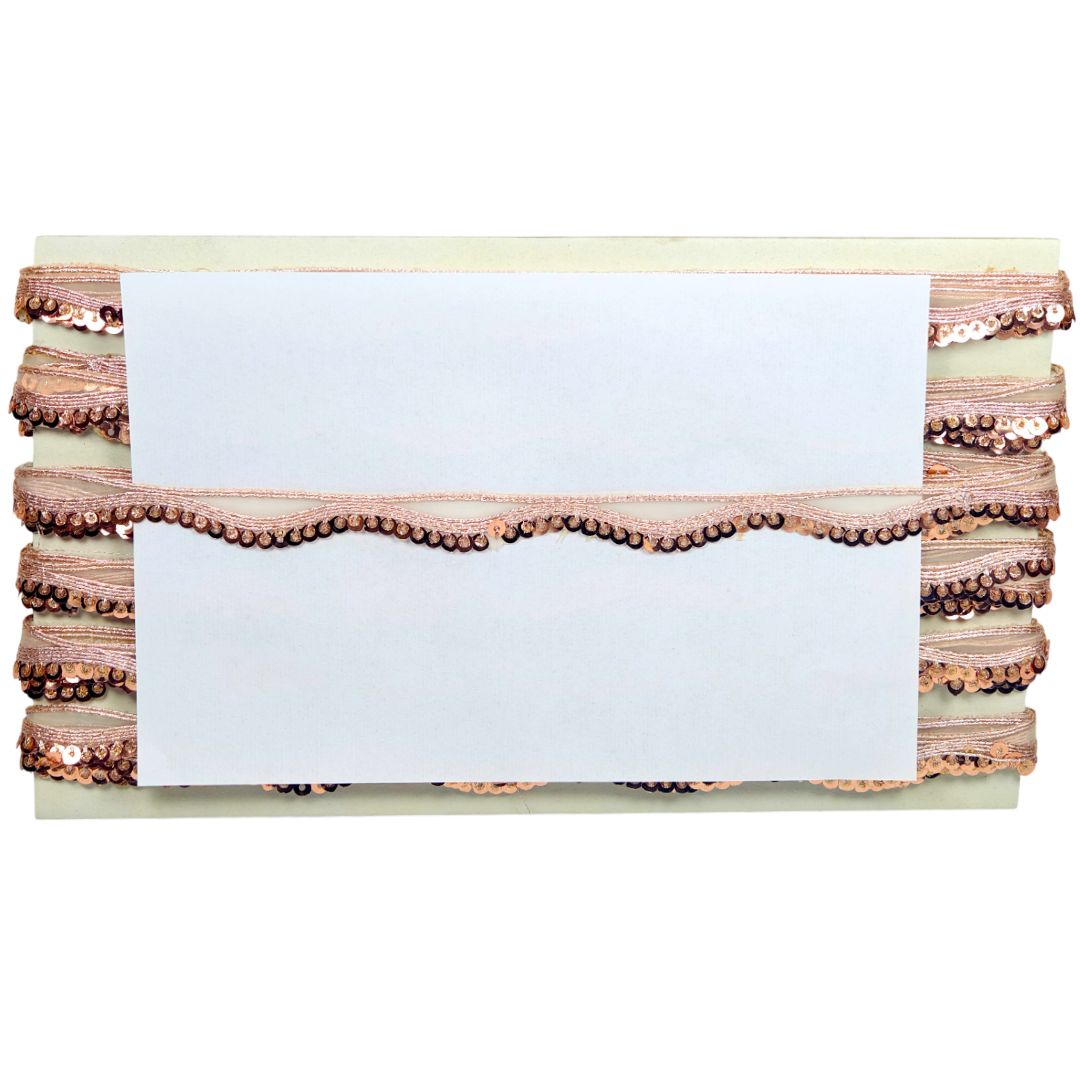 Stack of pink and white layered cakes with a white card on top