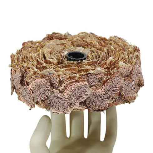 Decorative item resembling a hand holding a woven basket on a white background