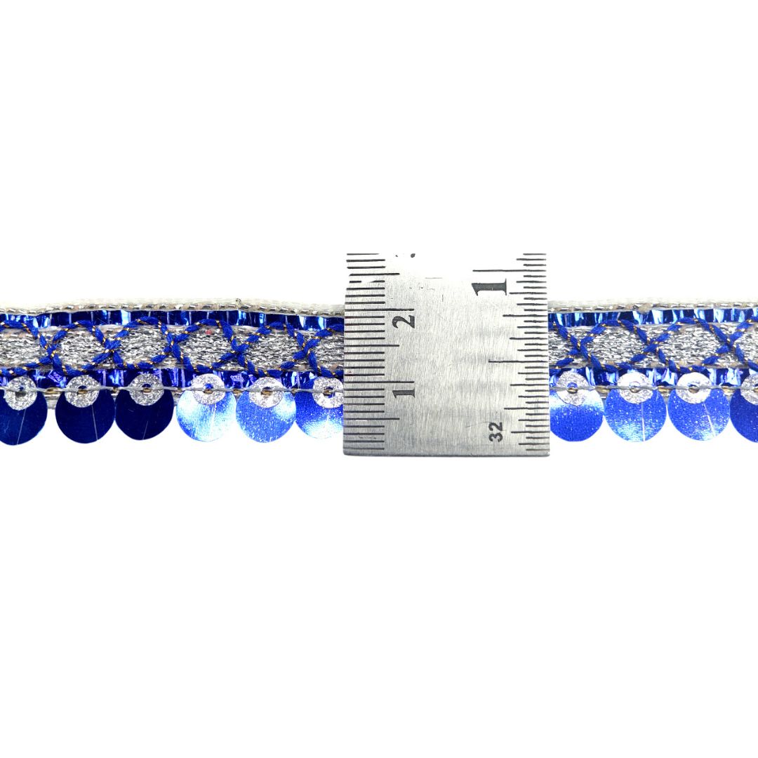 Blue and silver beaded trim with a measuring tape for scale on a white background