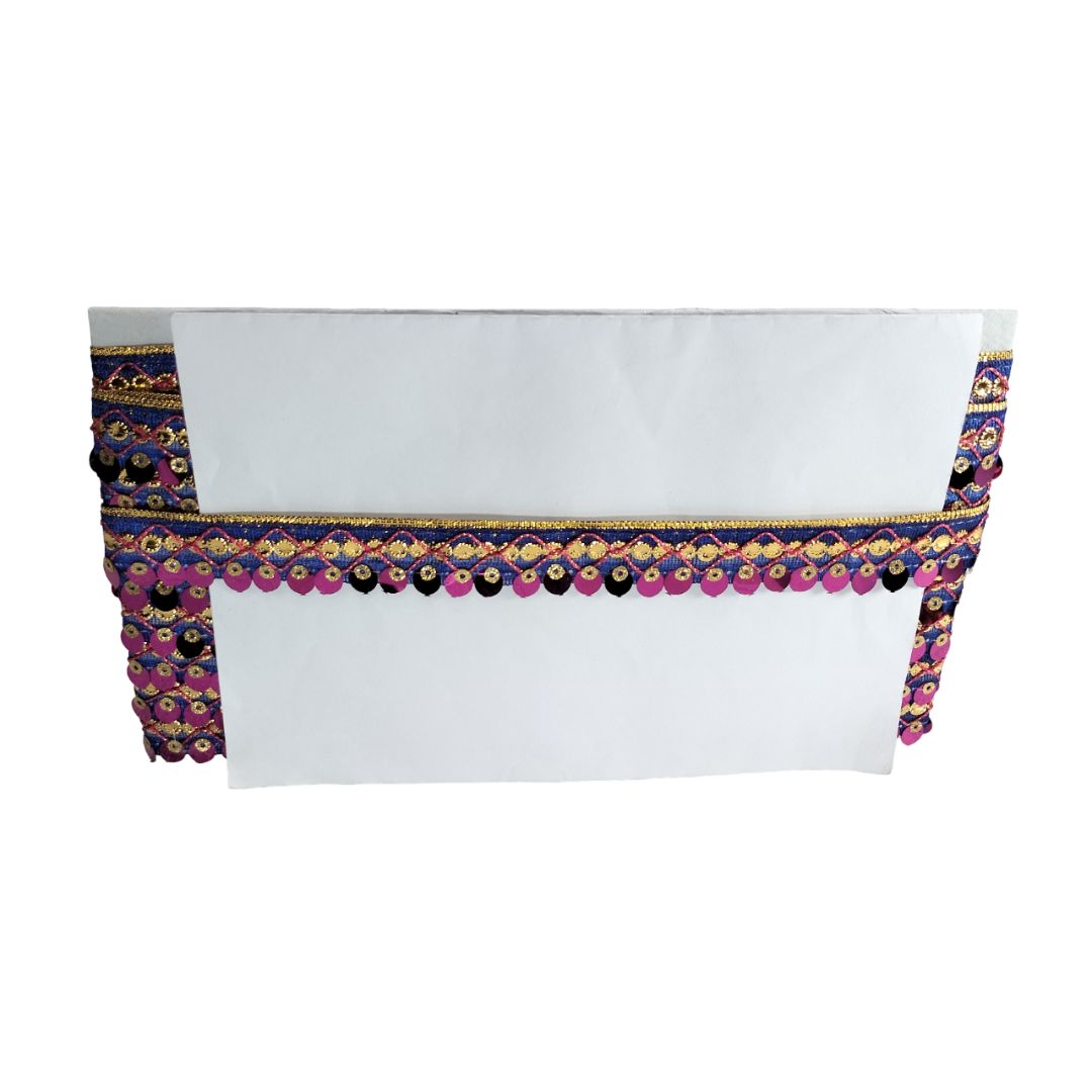 White top with colorful decorative trim on a white background