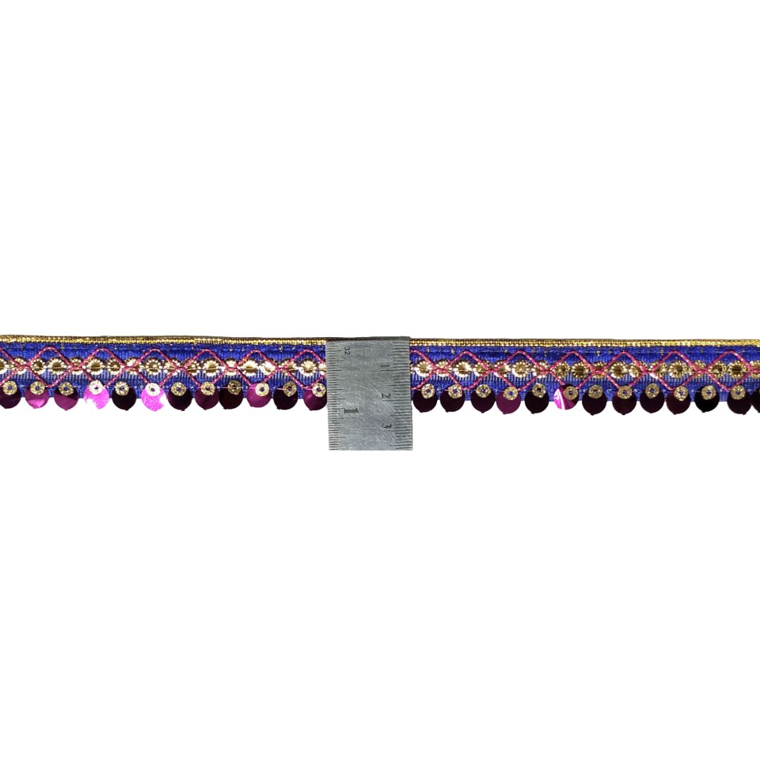 Decorative border with colorful patterns and a ruler for scale on a white background