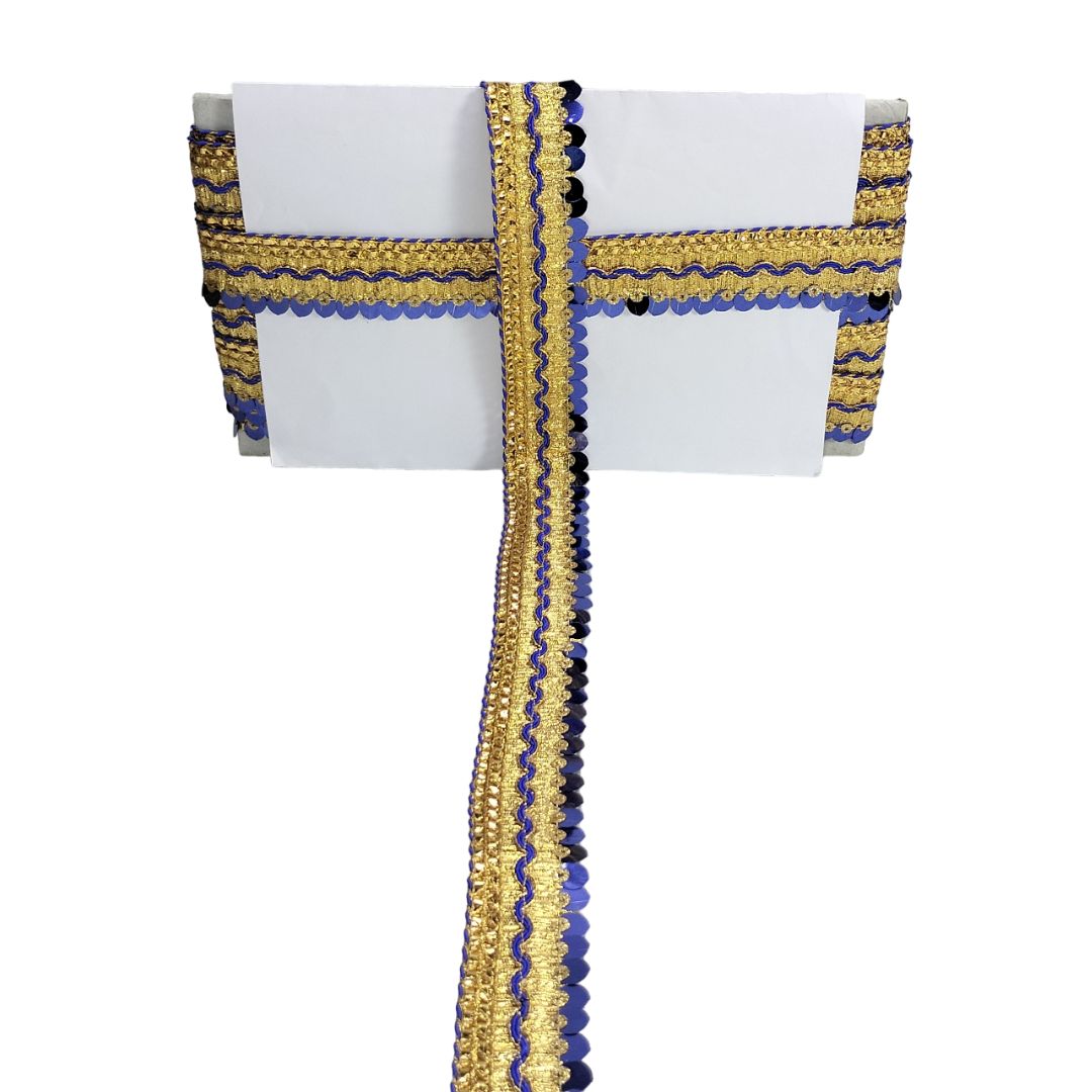 Decorative ribbon with gold and blue patterns on a white background