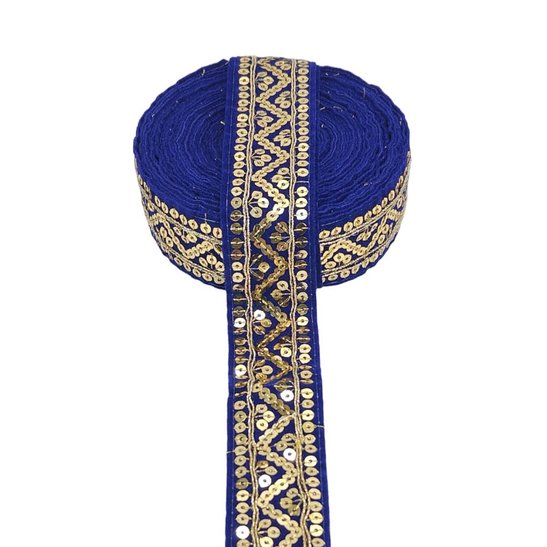 Blue ribbon with gold and white embroidery on a white background