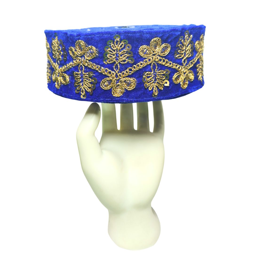 Blue velvet headband with gold embroidery on a mannequin head against a white background