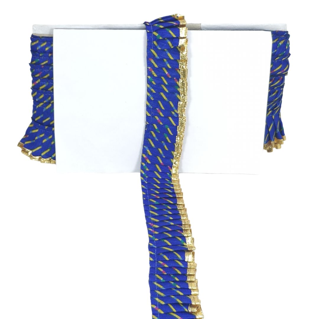 Blue fabric with gold patterns on a white background