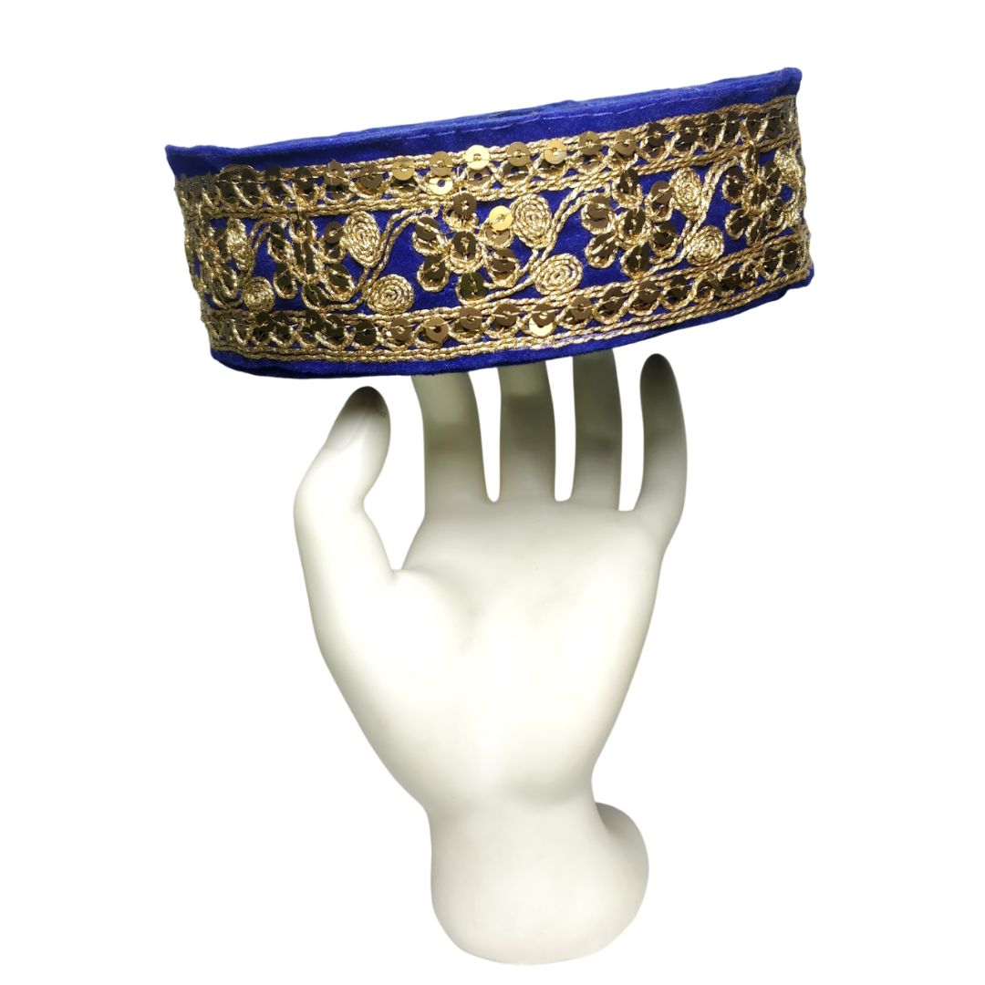 Decorative headband with gold embroidery on a mannequin head against a white background