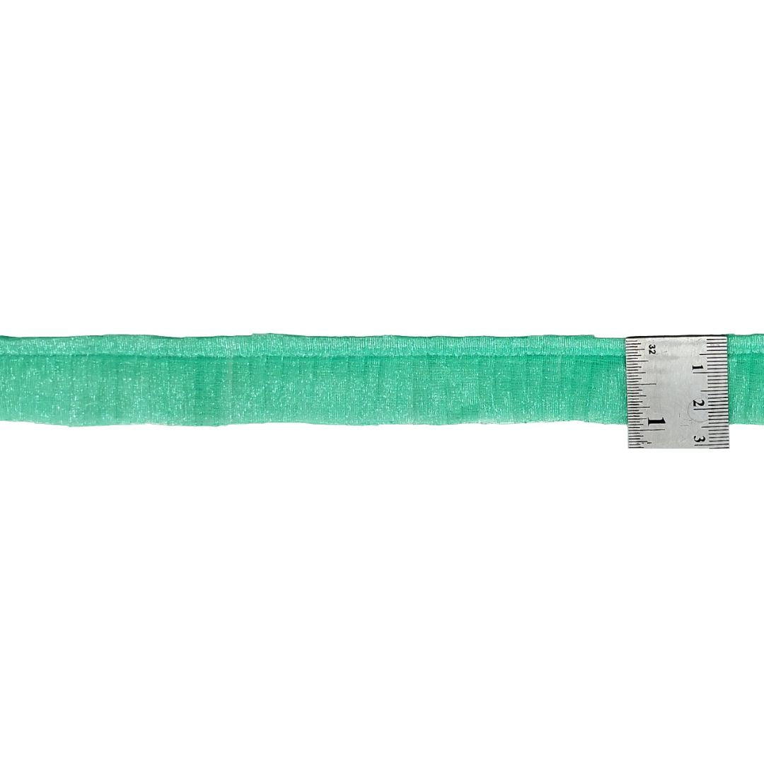 Green belt with a metal measuring tape on a white background
