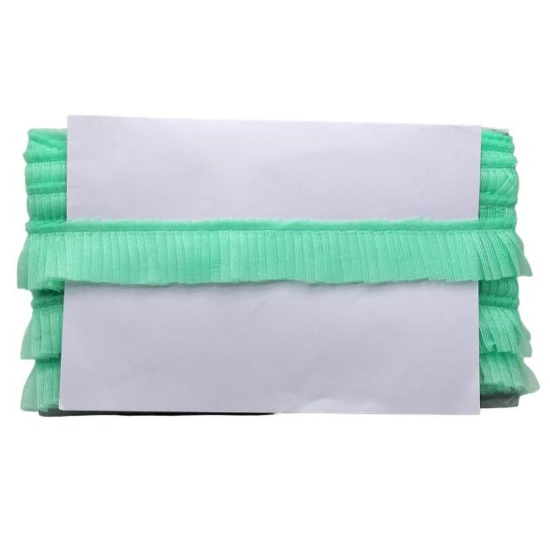 Stack of white papers with green ribbed border on a white background