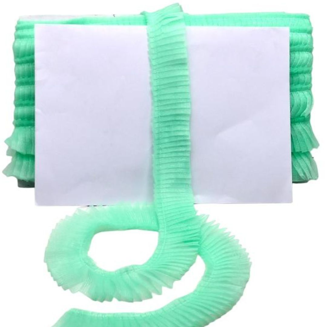 Green pool cleaning brush with a white background