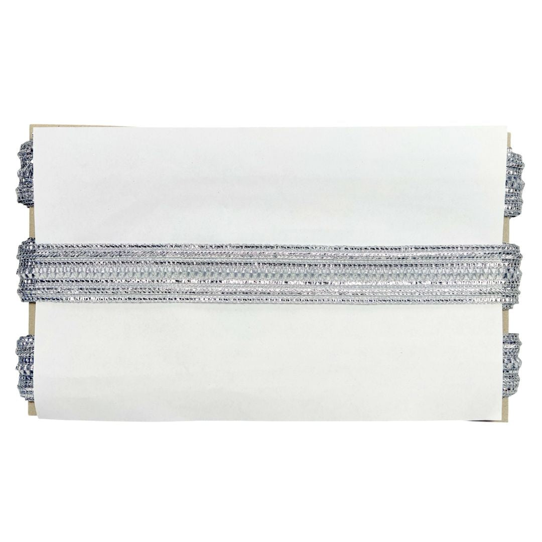 White clutch with silver and gray beaded detailing on a white background