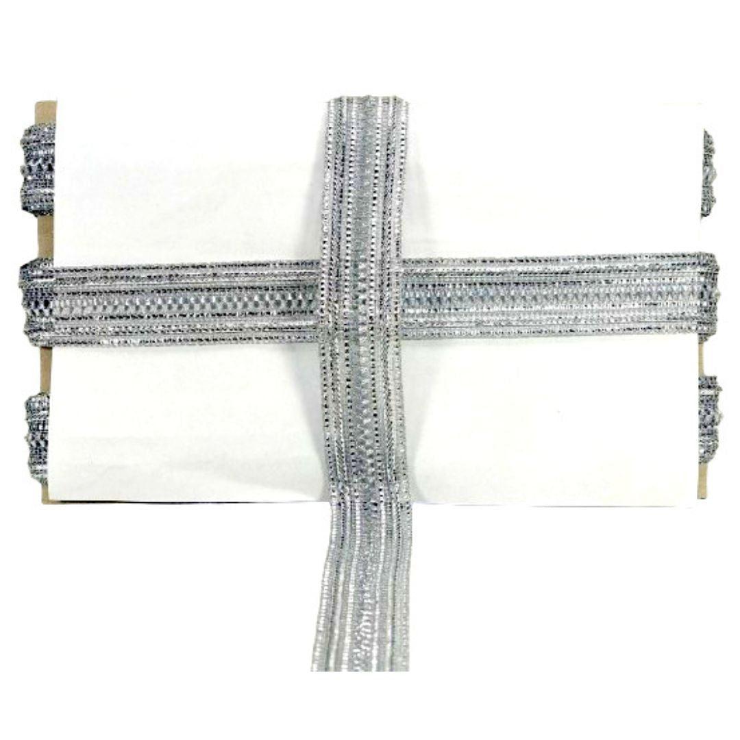 Decorative pillow with silver trim on a white background