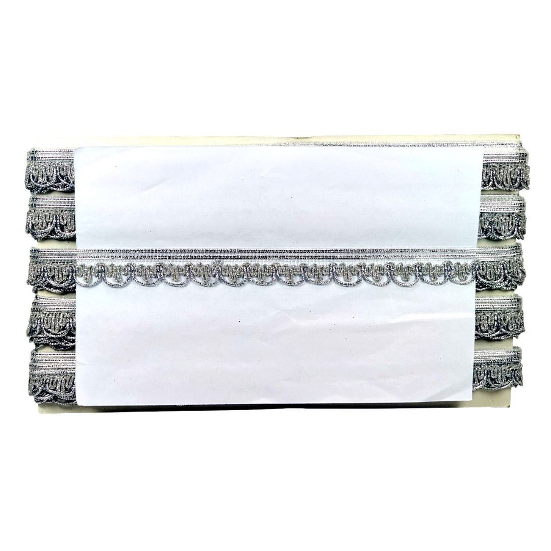 White towel with decorative black and gray border on a white background