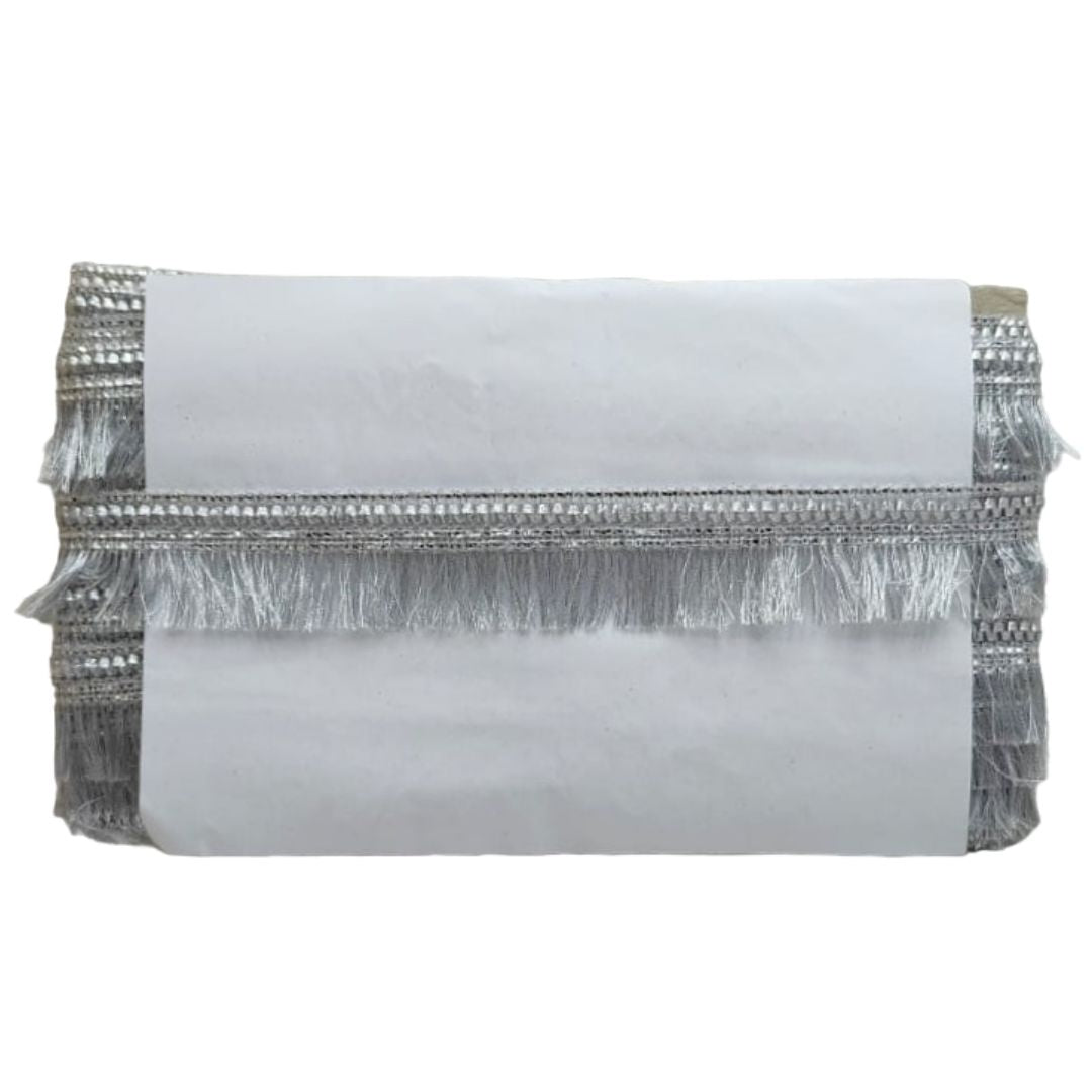 White clutch with silver fringe on a white background