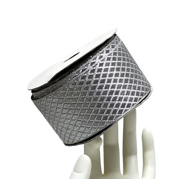 Silver mesh headband on a white mannequin hand against a white background