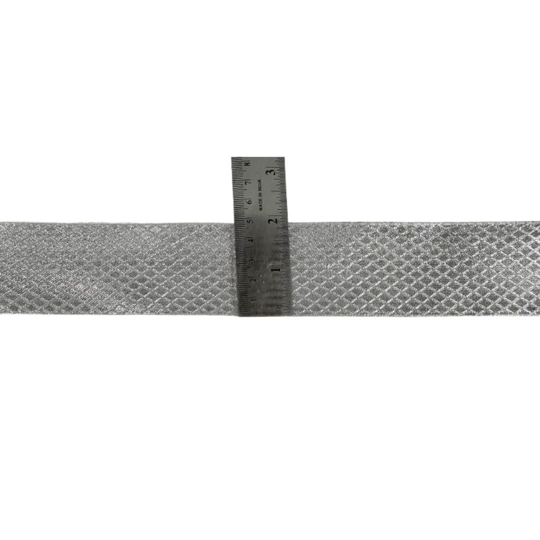 Metallic tape with a ruler for measurement on a white background
