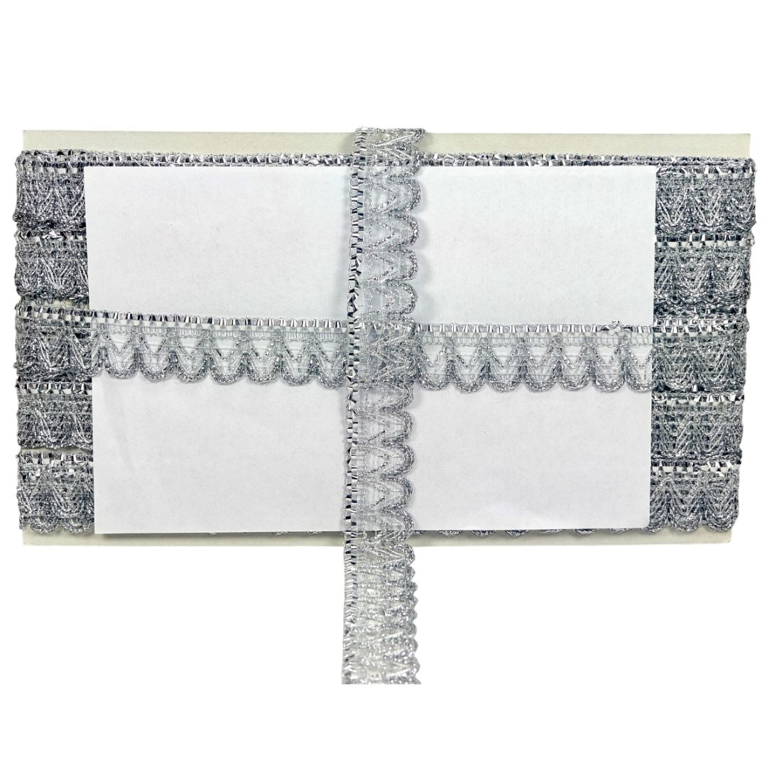 White clutch with silver embellishments on a white background
