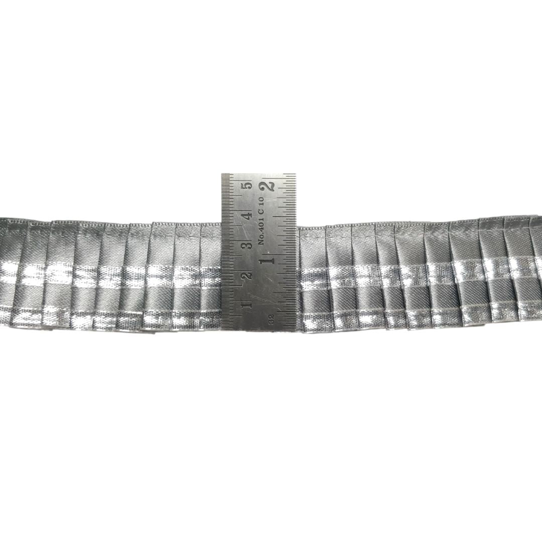 Gray plaid ribbon with a ruler for measurement on a white background