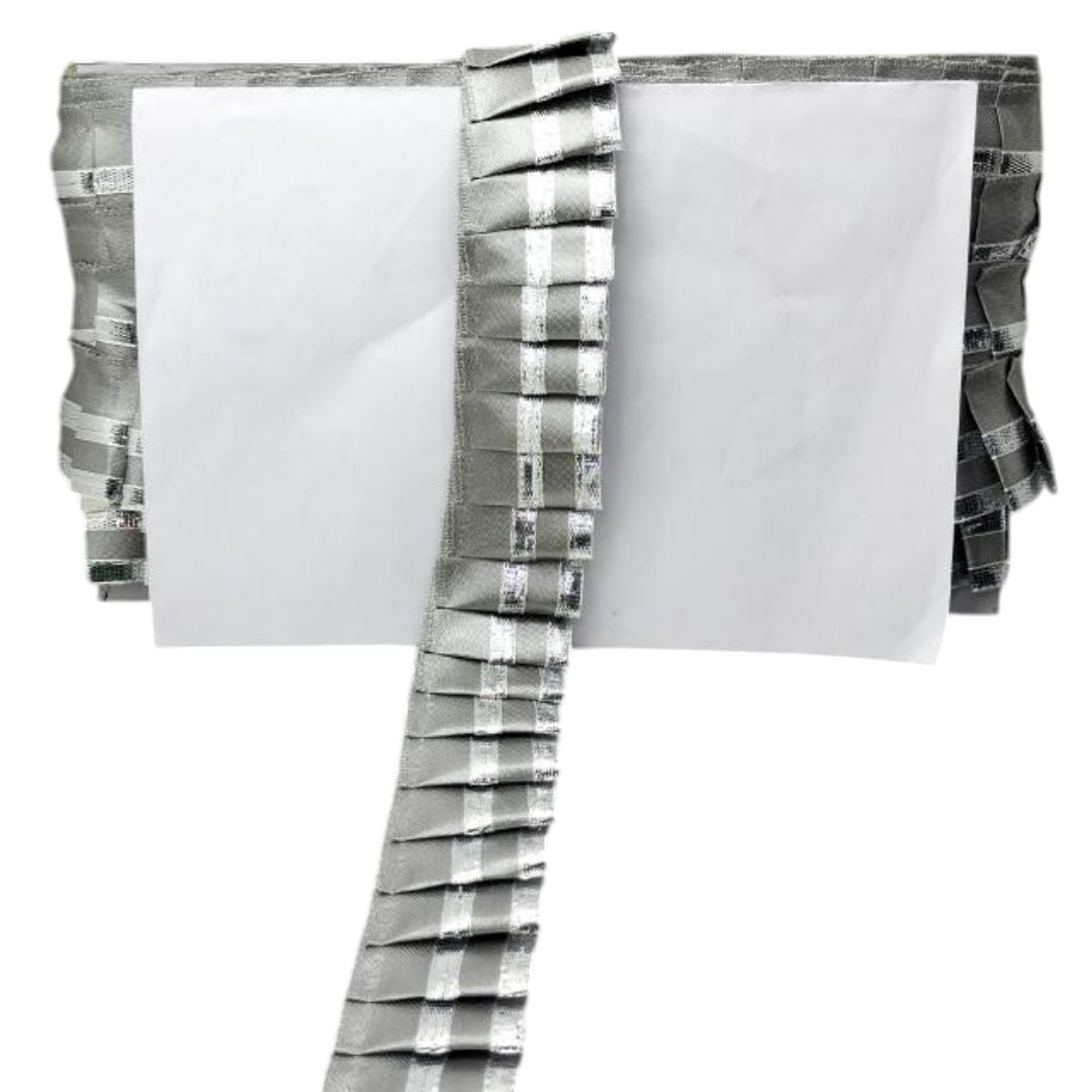 Set of folded towels with gray and white checkered patterns on a white background