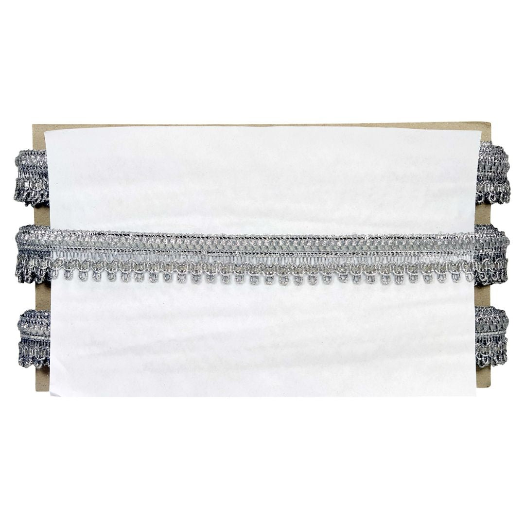 Decorative headboard with tassels on a white background