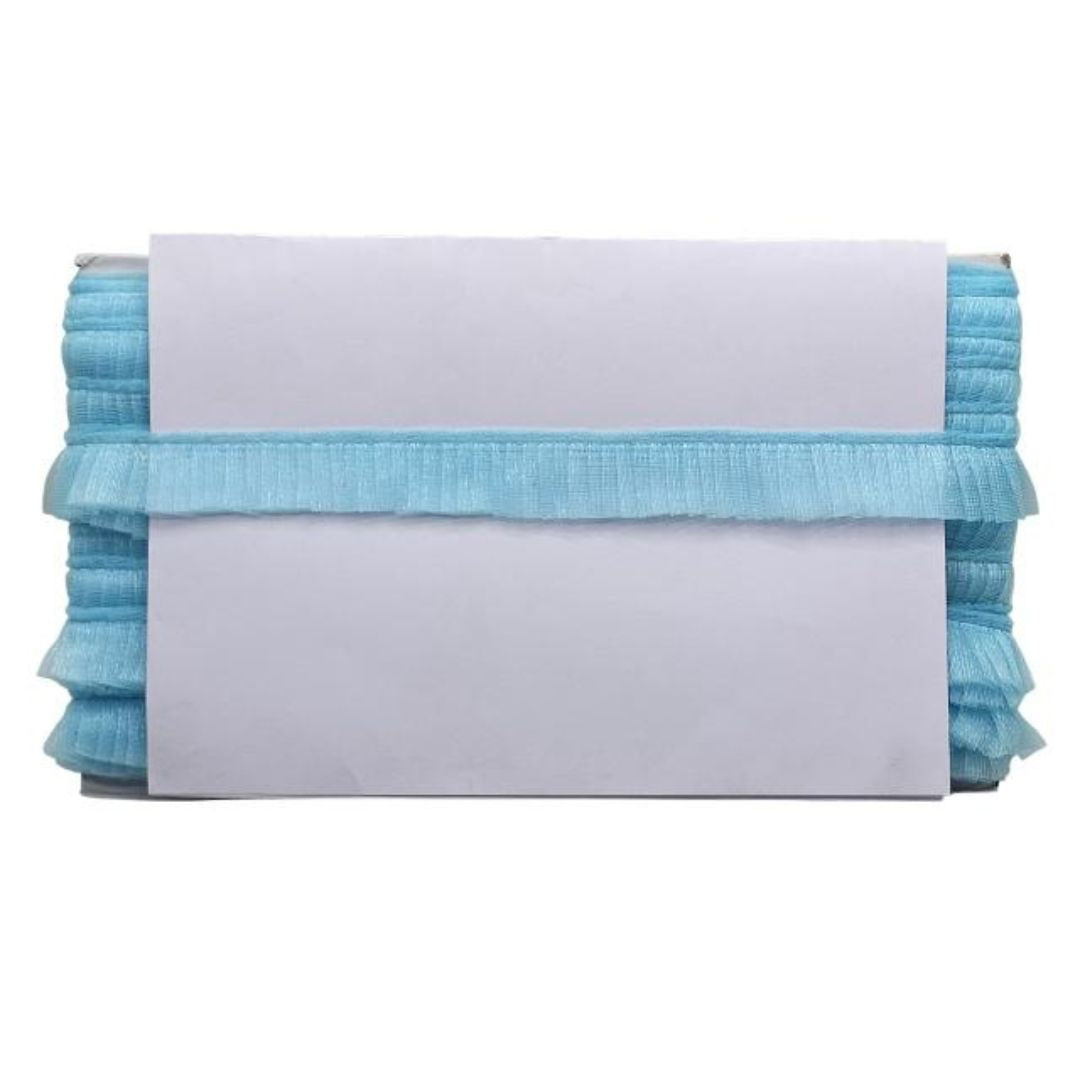 Stack of light blue fabric with a white label on a white background