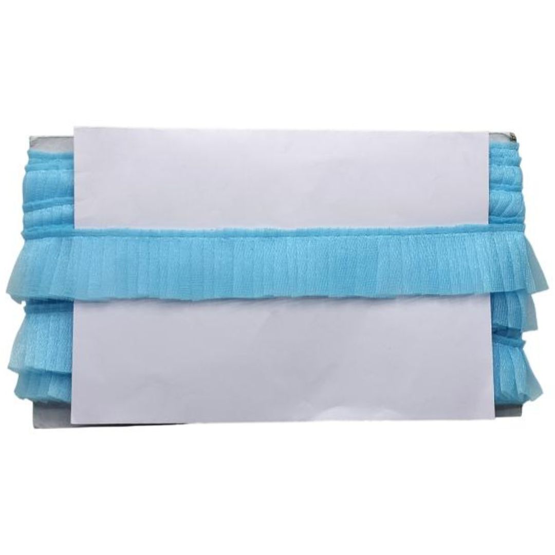 Stack of blue and white layered cloths on a white background