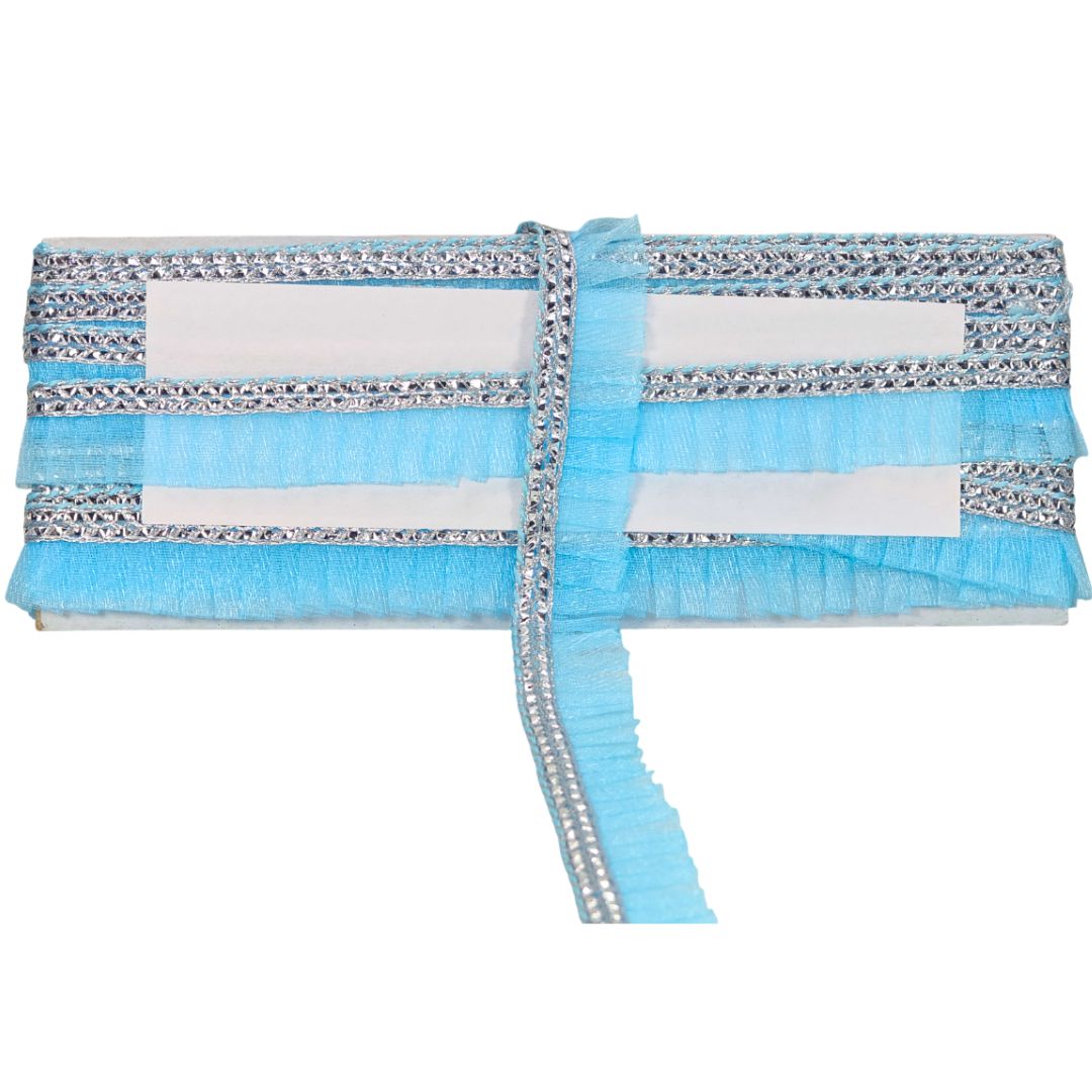 Blue clutch bag with silver embellishments on a white background