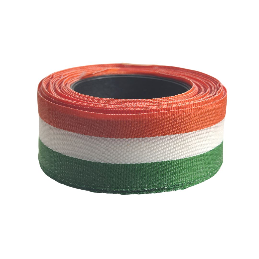 Roll of ribbon with Orange, white, and green stripes on a white background