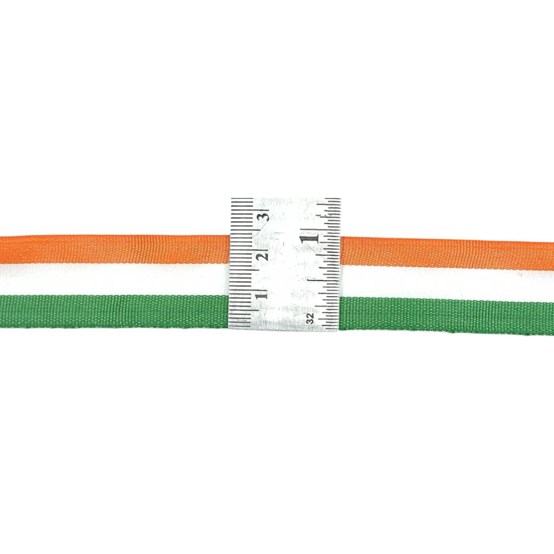 Tri-color ribbon with a ruler for measurement on a white background