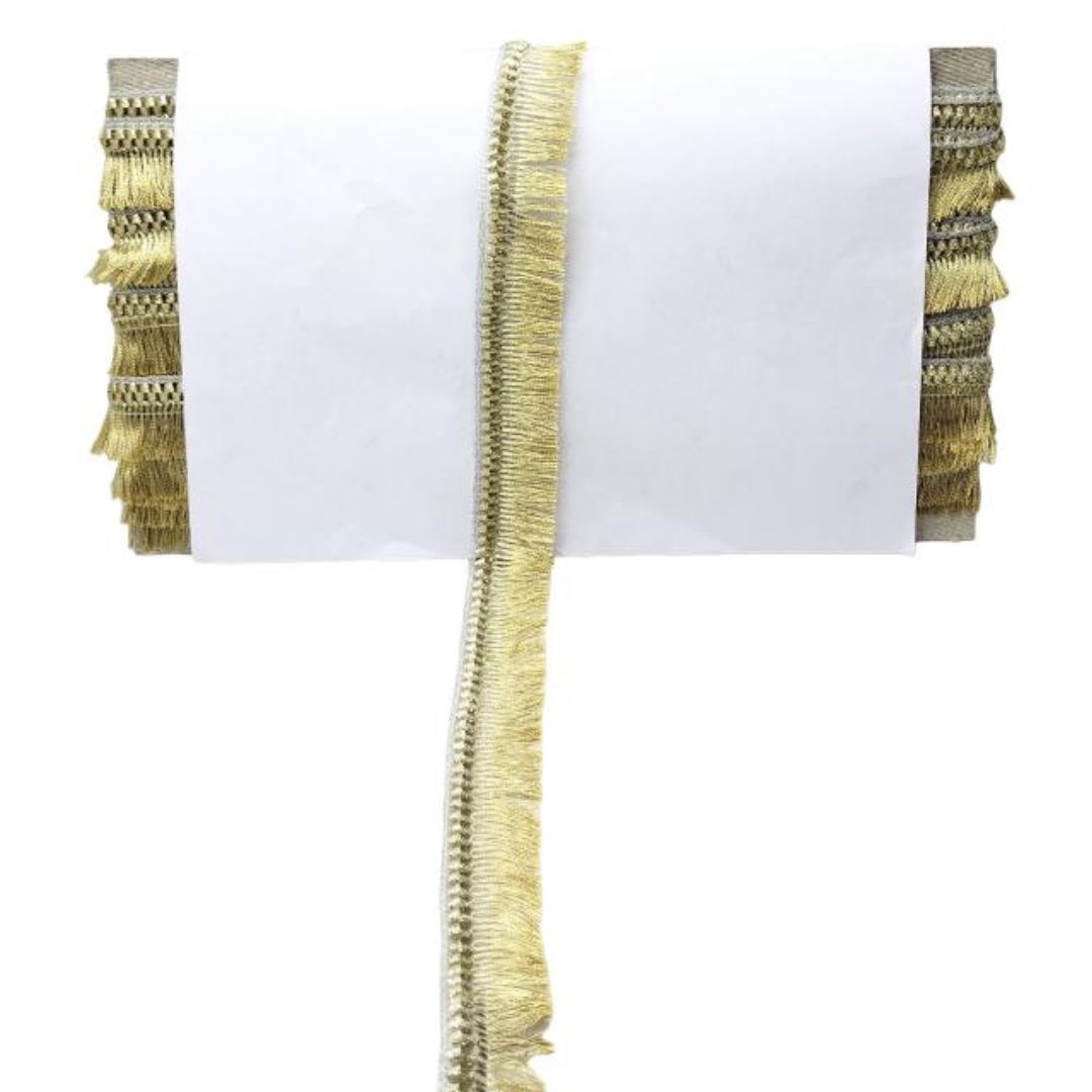 Decorative gold fringe trim on a white background
