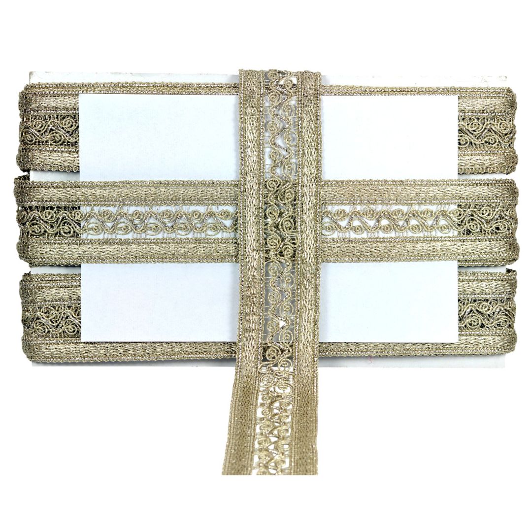 Decorative gold lace ribbon on a white background