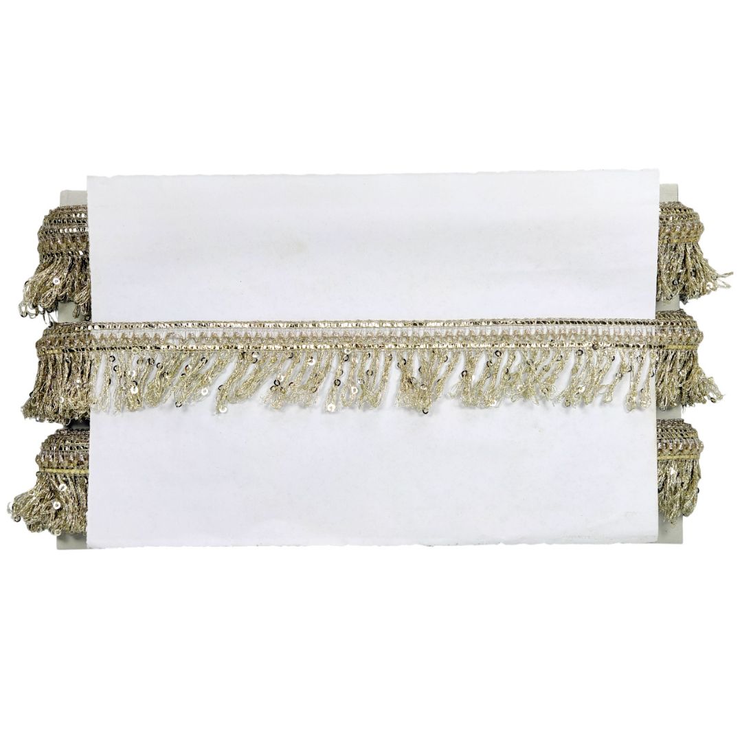 White clutch with gold fringe on a white background