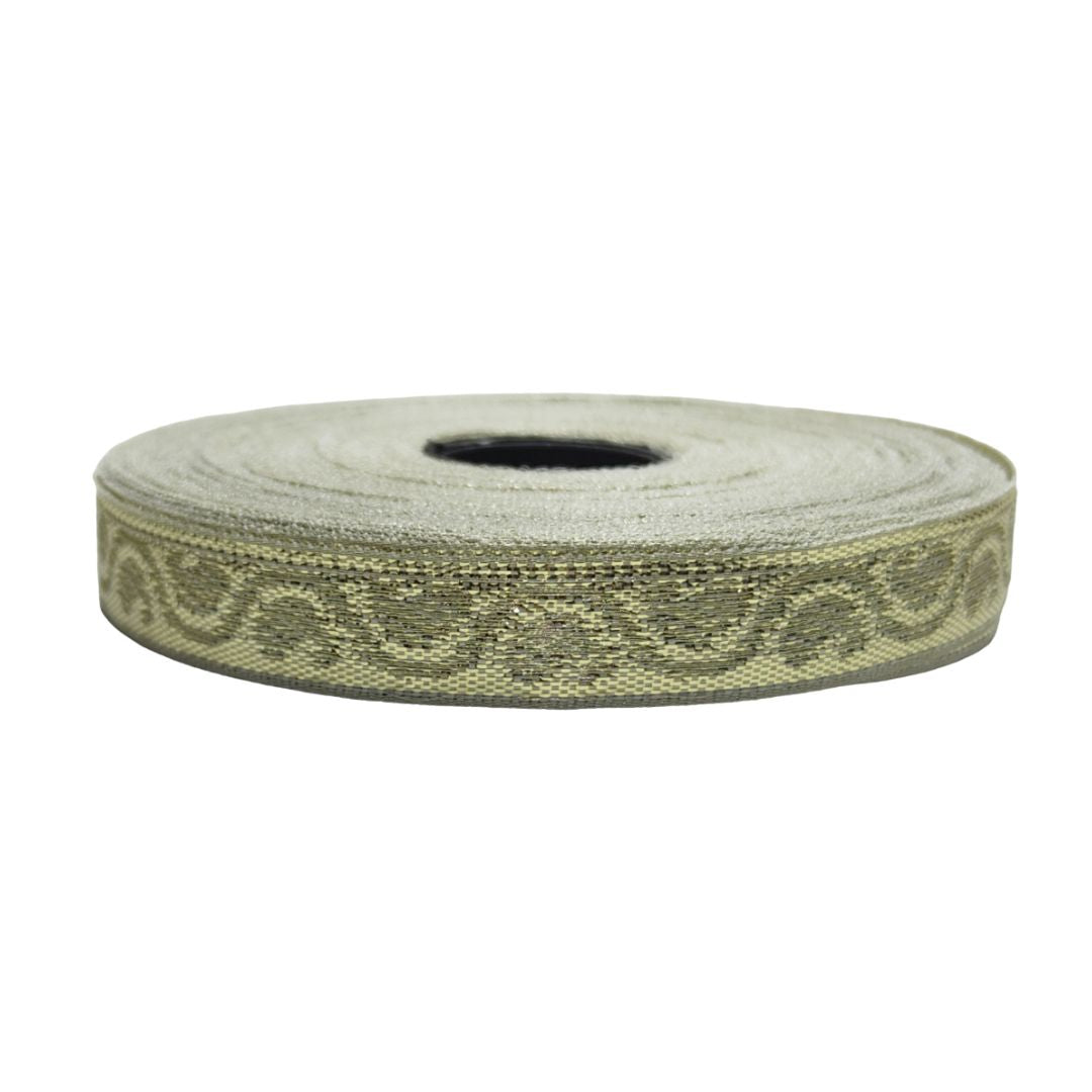Roll of green ribbon with a pattern on a white background