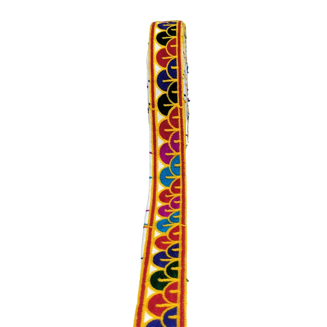 Colorful guitar strap with a pattern on a white background