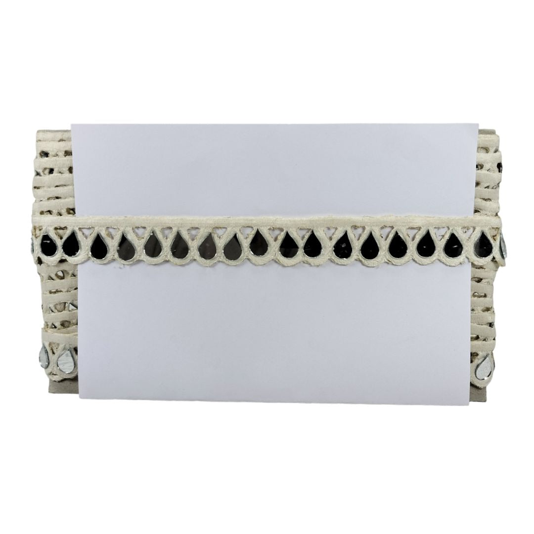Wicker card holder with decorative trim on a white background