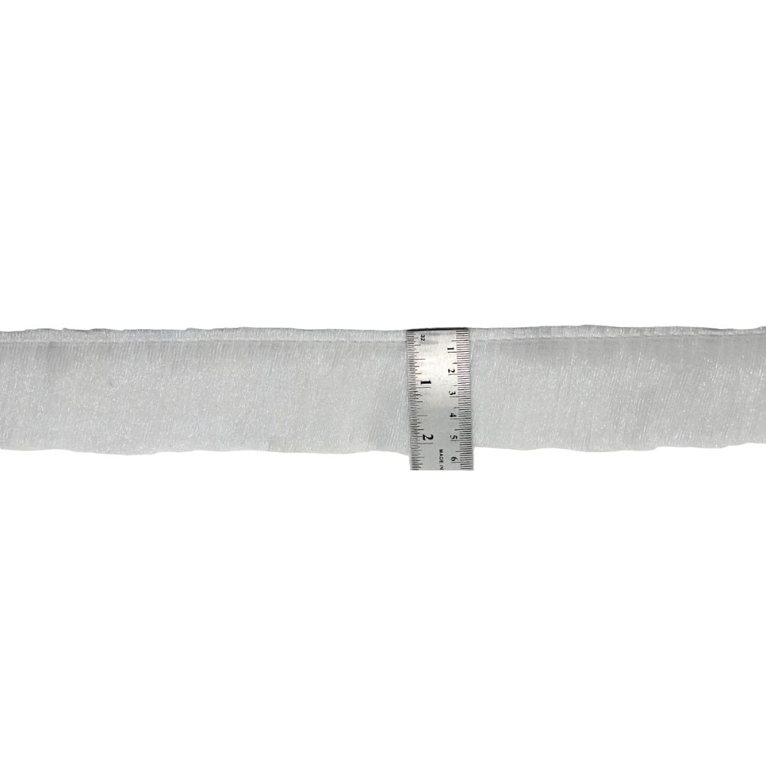 Gray fabric with a ruler for scale on a white background