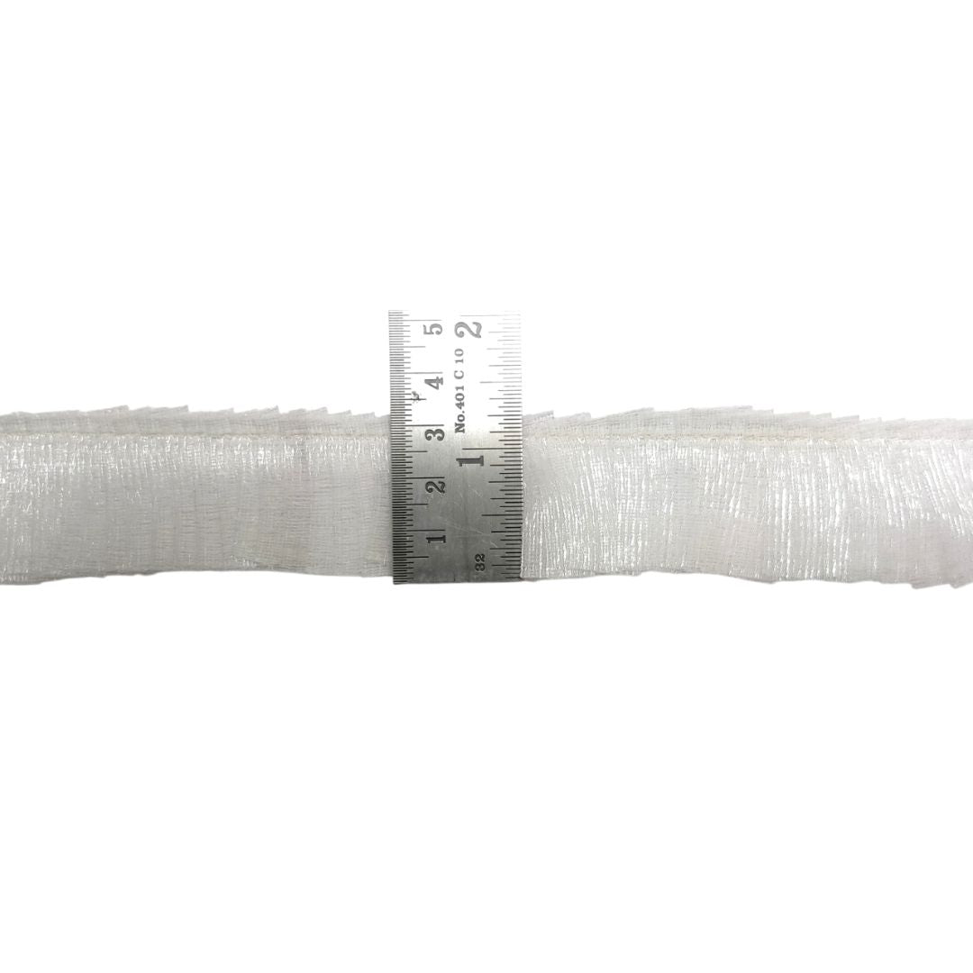 White woven fabric with a ruler for scale on a white background