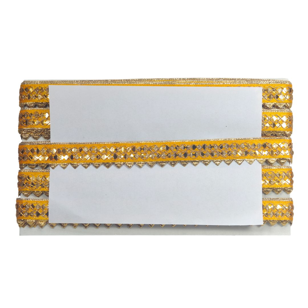 Gold and white clutch bag with decorative patterns on a white background