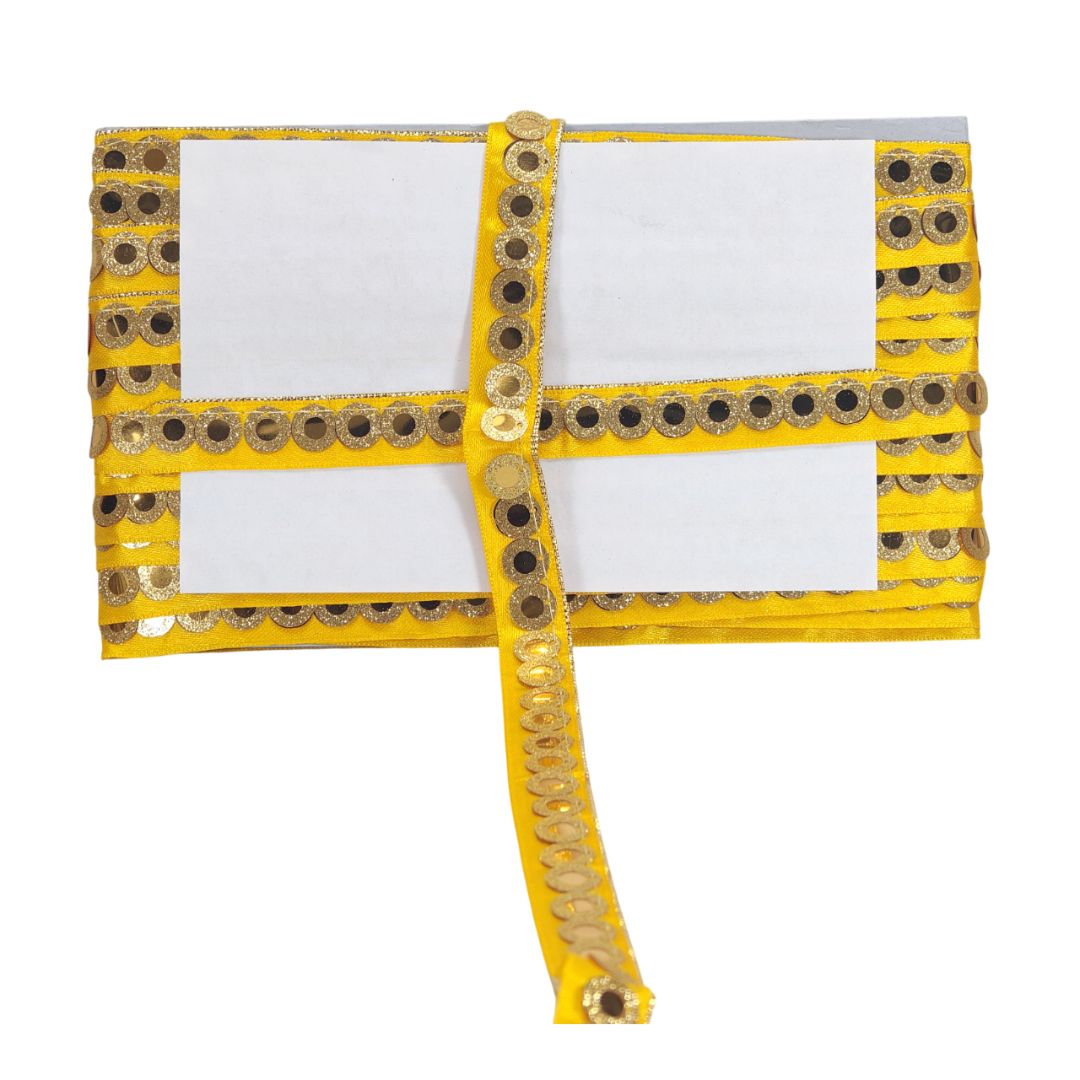 Yellow clutch with decorative gold embellishments on a white background